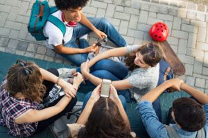 teenagers with phones