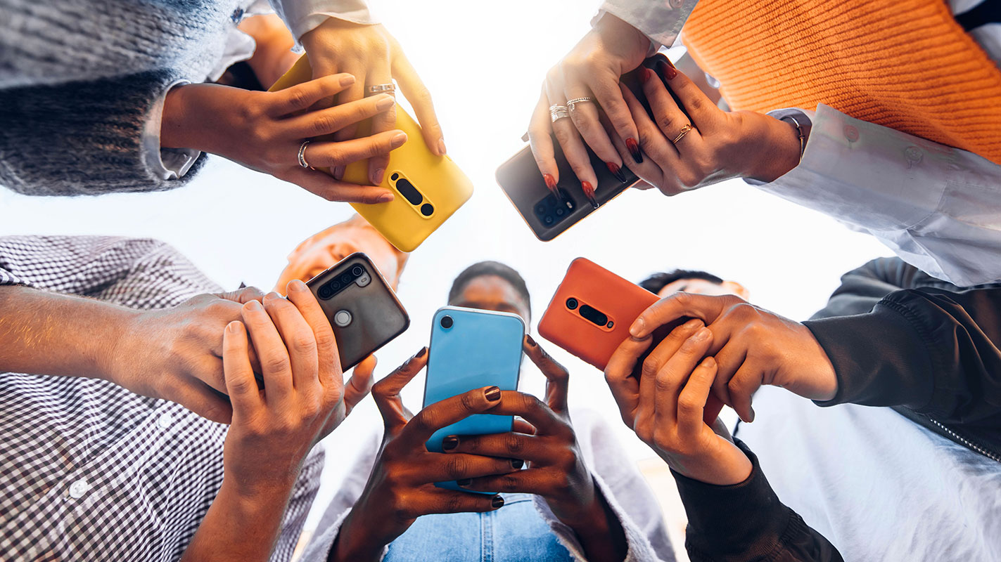 Group of people using mobile phones