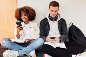 Students looking at mobile devices