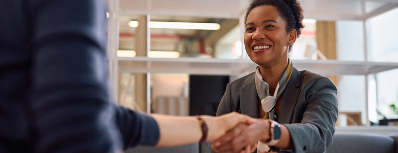 a bank manager greets her client in her office