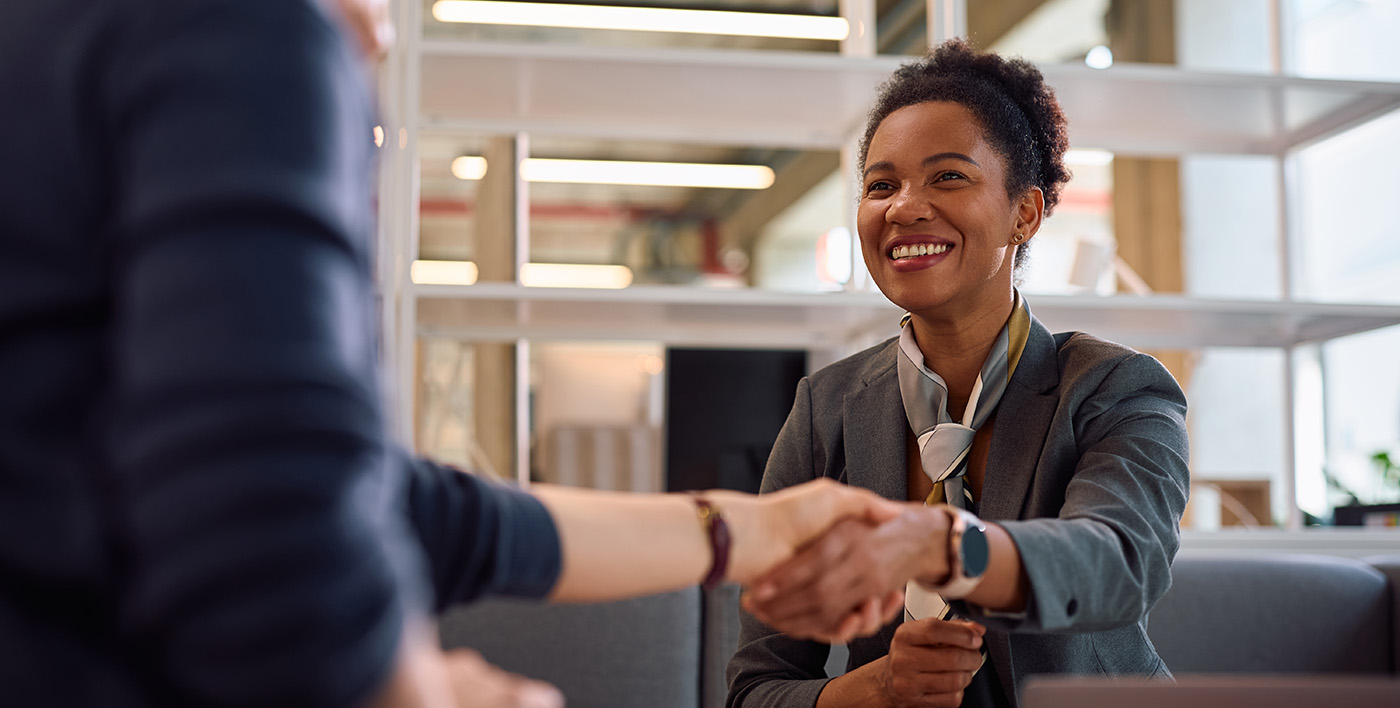 a bank manager greets her client in her office